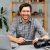 young-man-photographer-sits-at-table-and-works-fro-UU4ZMUH.jpg